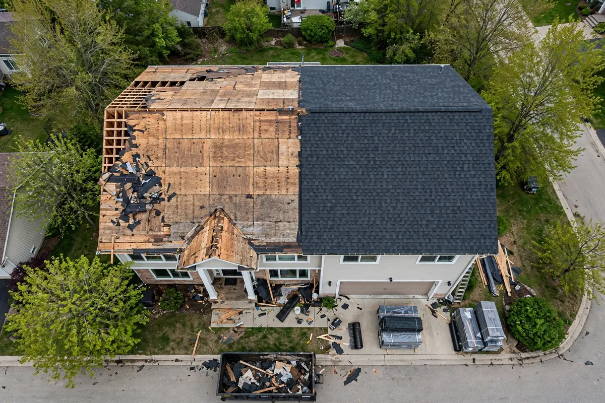 Aerial view of a full roof replacement in progress.